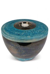 Urna de cerâmica artesanal com porta velas